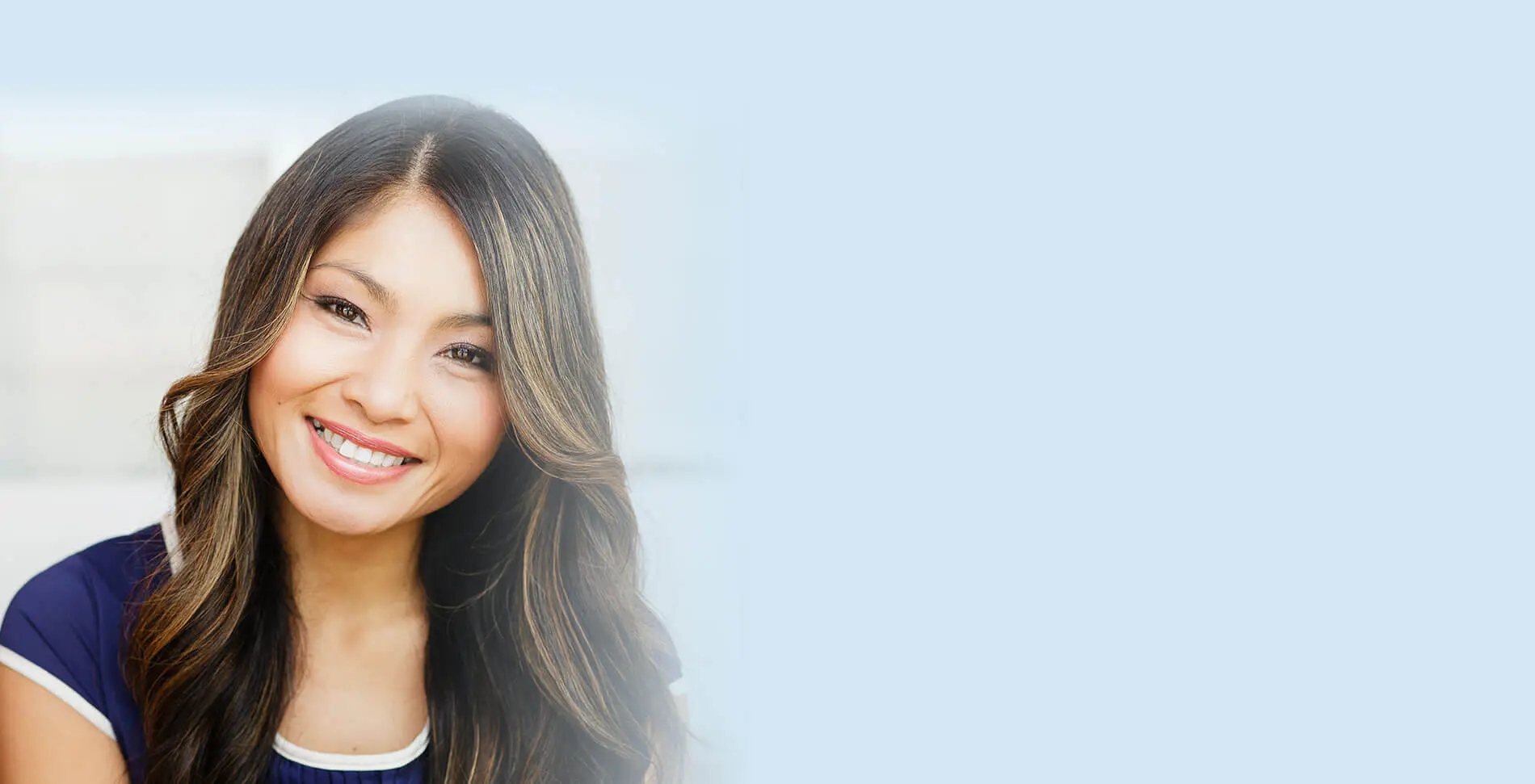 Close-up of a pretty Asian woman smiling in the city